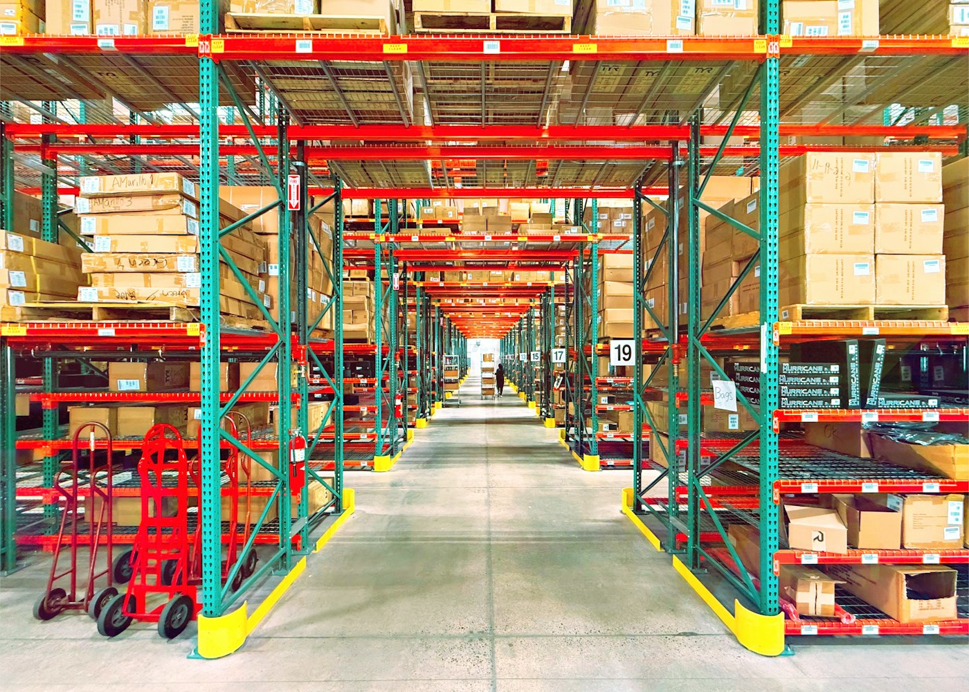 Warehouse aisles lined with inventory racks