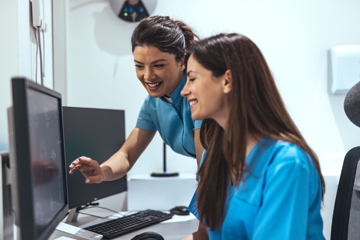Clinician reviewing patient information on a tablet