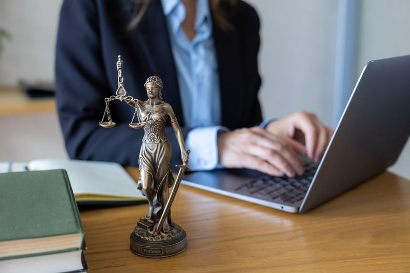Judge's gavel and legal books on a wooden desk